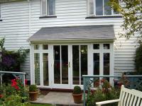 Full height glass with tiled roof