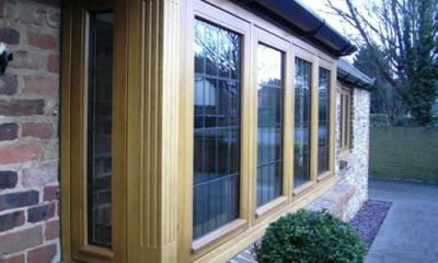 Oak bay window with fluted corner posts
